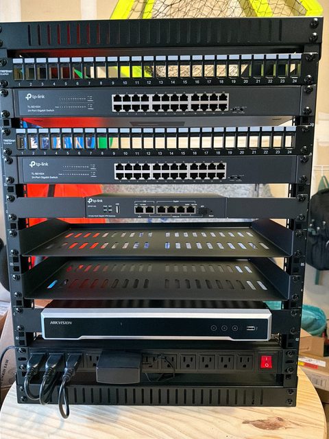 Equipment rack with network switches, shelves and power distribution